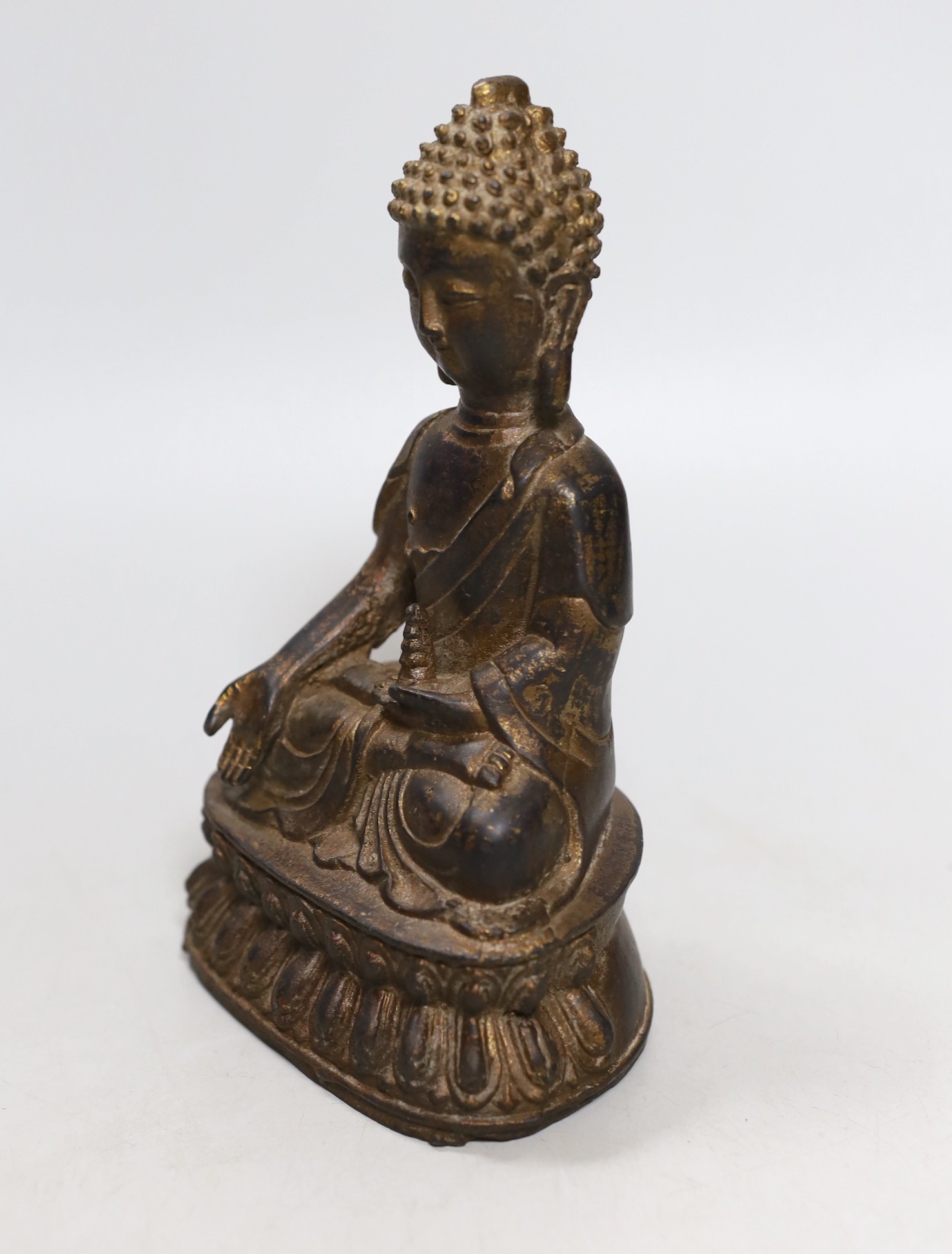 A Chinese gilt iron seated figure of Buddha, 19cm
